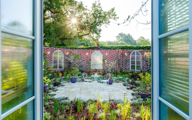 Garden view at Domaine du Chaumont-sur-Loire Castle, Loire Valley, with patio seating.