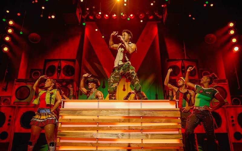 Performer and dancers on stage at Bob Marley The Show, Vegas.