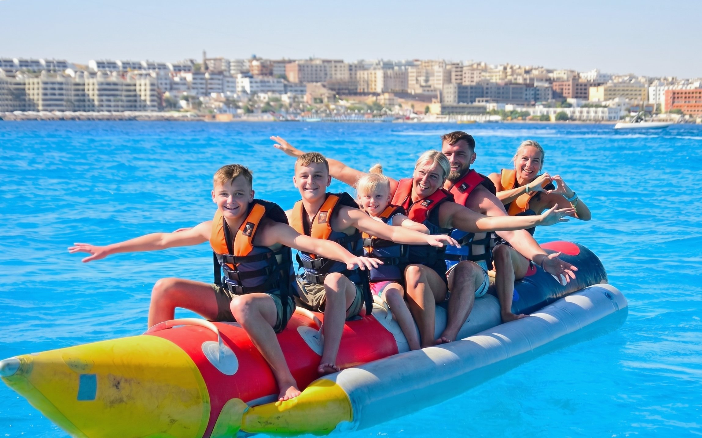 Group enjoying banana boat ride on Orange Bay Island, Hurghada.