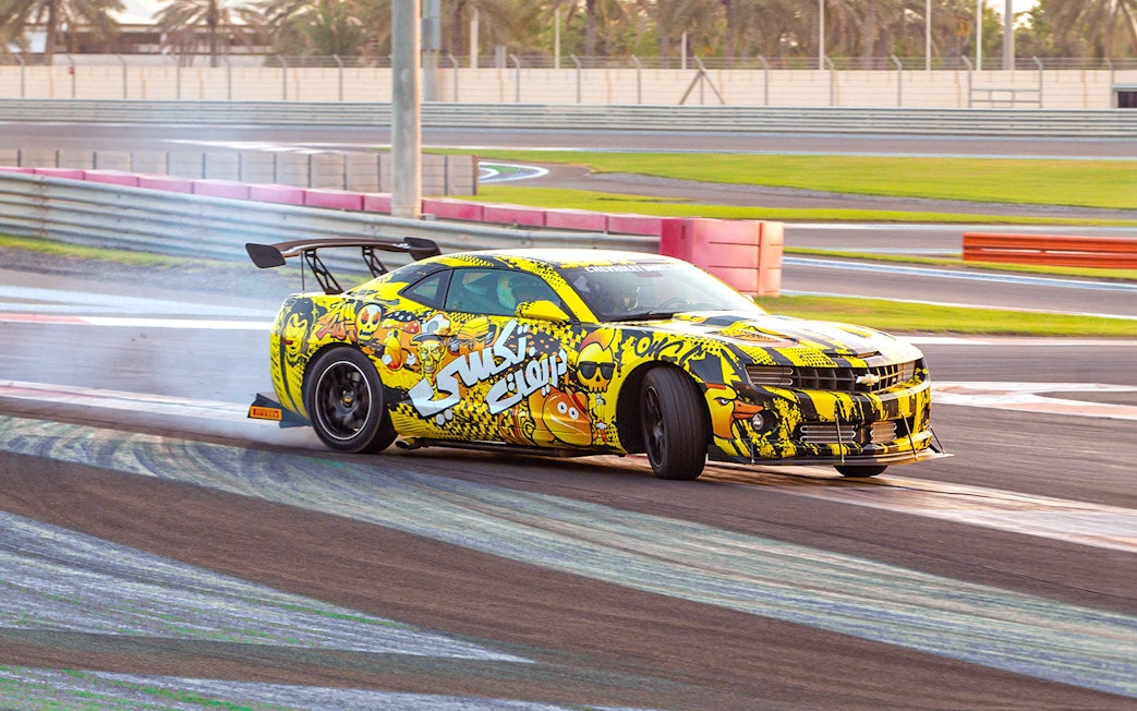 Chevrolet drifting at Yas Marina Circuit during passenger experience.