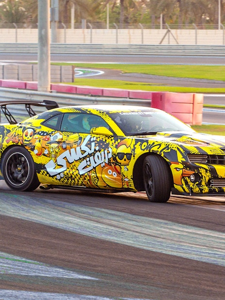 Chevrolet drifting at Yas Marina Circuit during passenger experience.