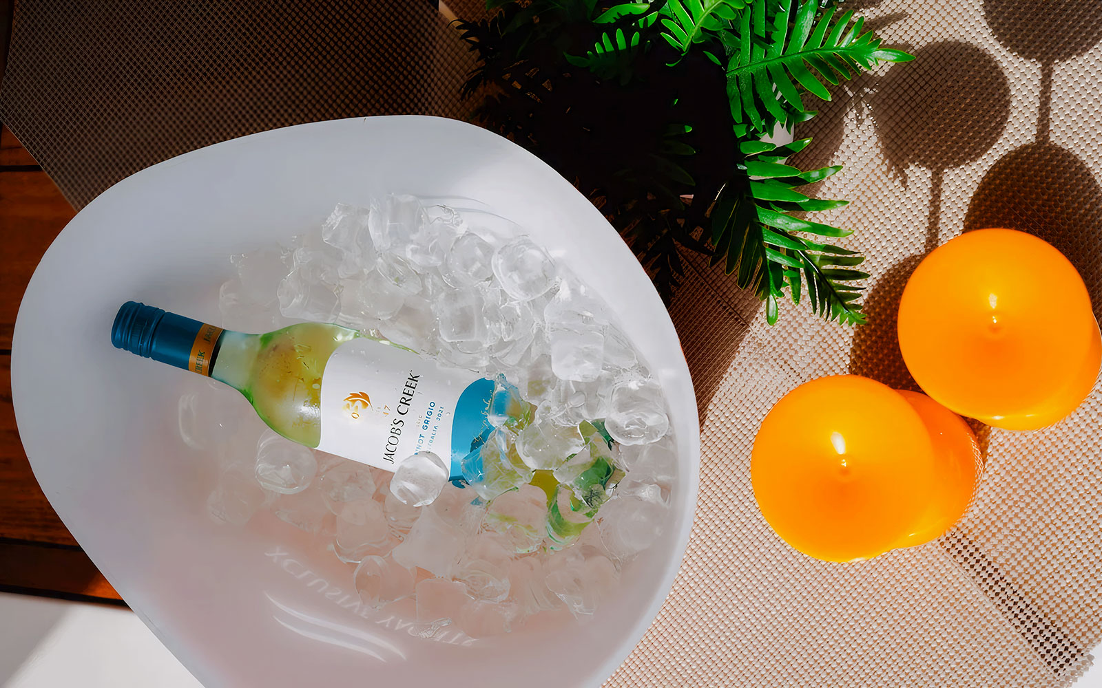 Wine bottle in ice bucket on luxury yacht, Dubai.