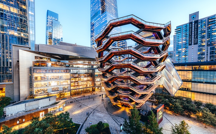 Vessel structure in Hudson Yards, New York City, surrounded by modern buildings.