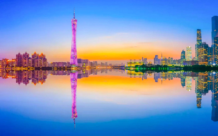 Canton Tower reflected in Pearl River at twilight, Guangzhou, China.