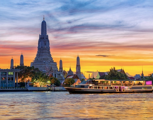 Grand Pearl cruise on Chao Phraya River, Bangkok, with Ayutthaya temple view.
