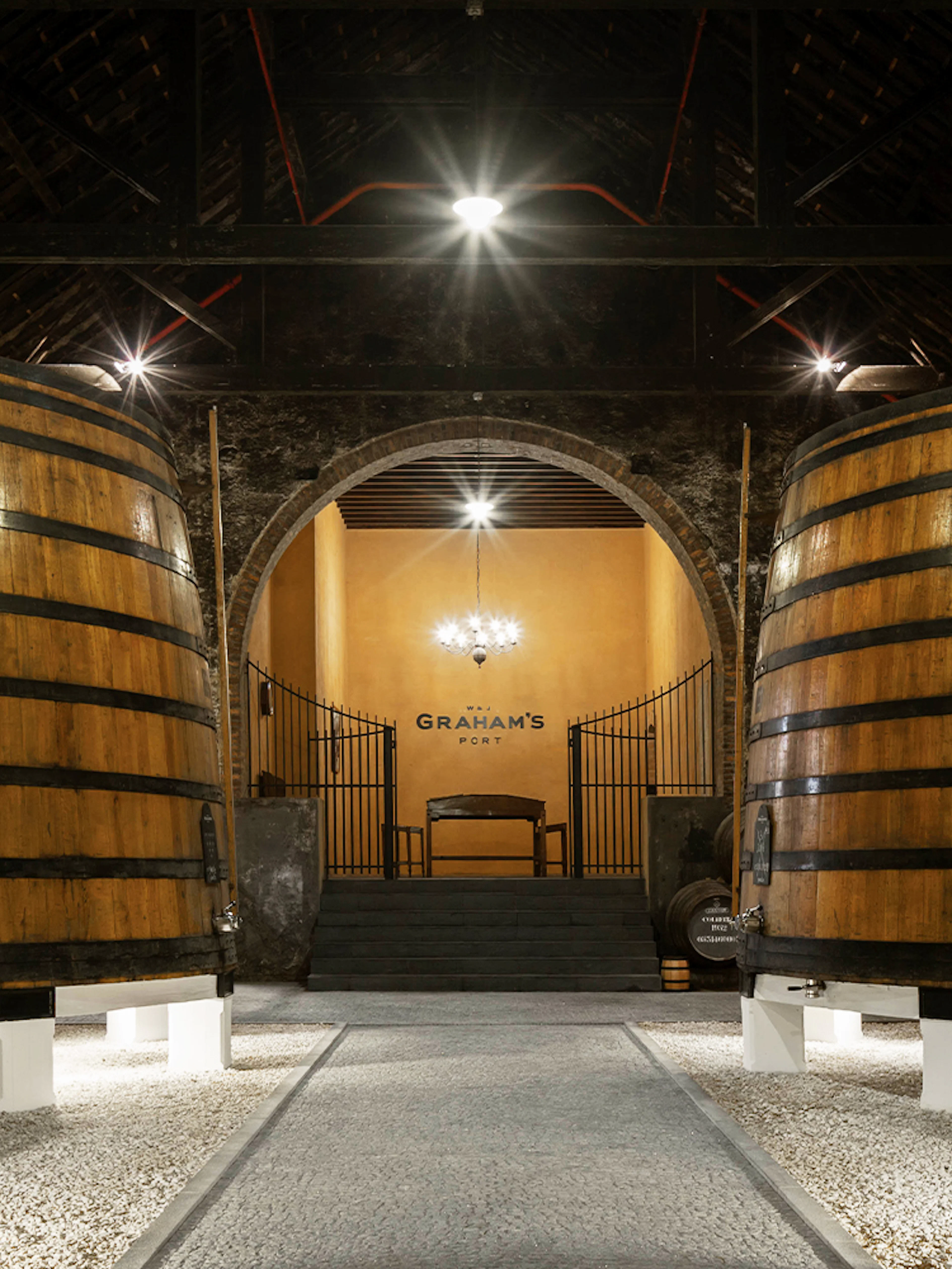 Graham’s Port Lodge interior with large wooden wine barrels.