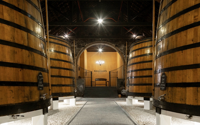 Graham’s Port Lodge interior with large wooden wine barrels.