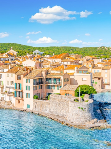 Saint-Tropez coastal view with historic buildings and blue sea, Provence, Cote d'Azur.