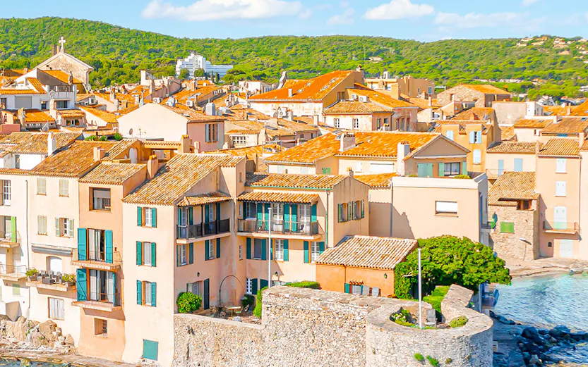 Saint-Tropez coastal view with historic buildings and blue sea, Provence, Cote d'Azur.