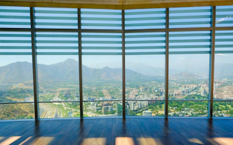 Observation deck view of Santiago, Chile from Sky Costanera, overlooking cityscape and mountains.