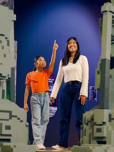 Child and adult admiring LEGO Star Wars sculptures at LEGOStarWarsTheExhibition.