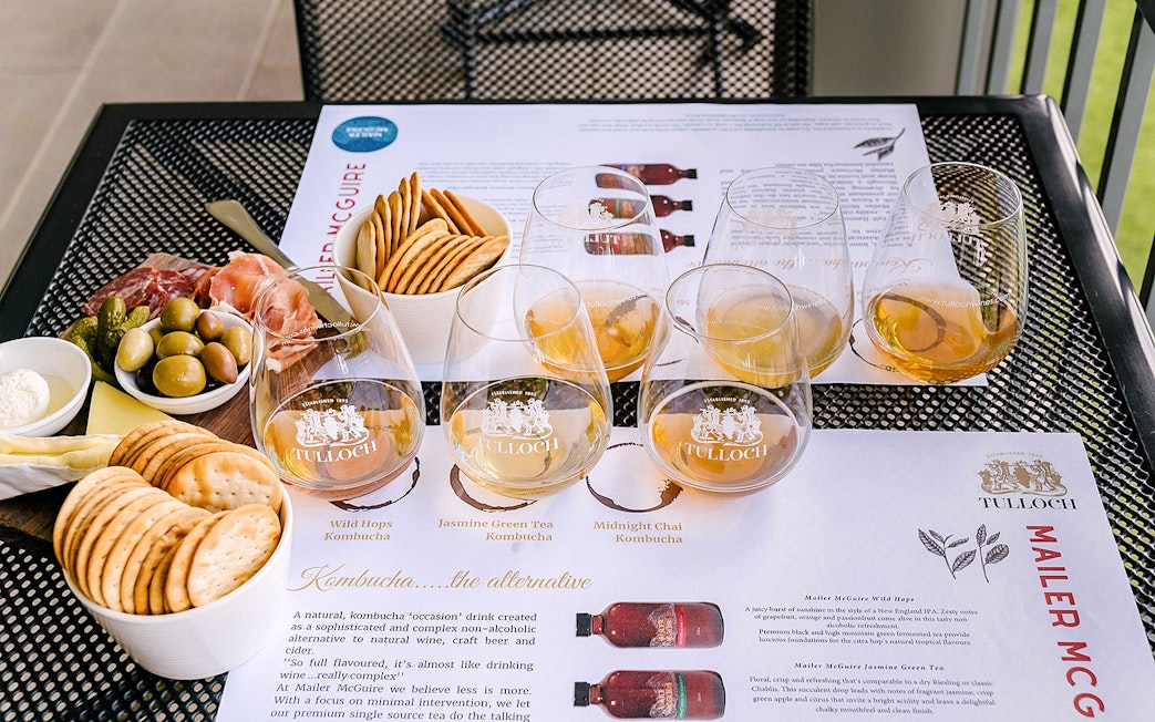 Tulloch Wines tasting with cheese board, featuring olives, crackers, and cured meats in Hunter Valley.