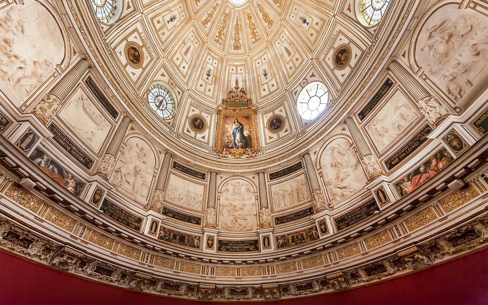 Seville Cathedral Chapter House interior with ornate dome and intricate architectural details.
