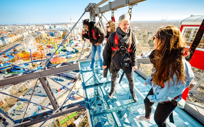 Passengers enjoying city view from Vienna Giant Ferris Wheel.