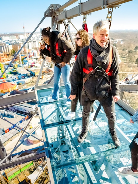 Passengers enjoying city view from Vienna Giant Ferris Wheel.