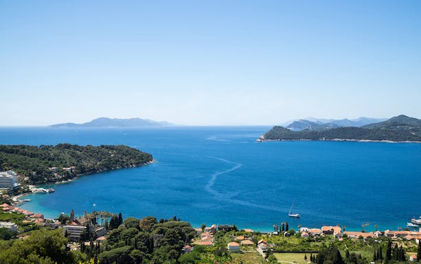 Dubrovnik Elaphites cruise view with islands and sailboats in the Adriatic Sea.