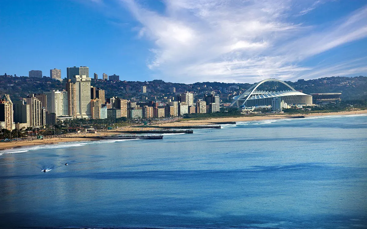 Durban skyline with Moses Mabhida Stadium and beachfront, South Africa.