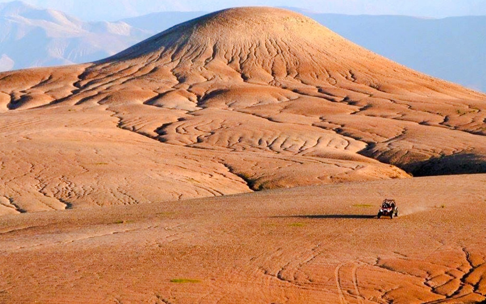 ATV driving across the Agafay Desert landscape near Marrakesh.