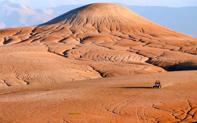 ATV driving across the Agafay Desert landscape near Marrakesh.