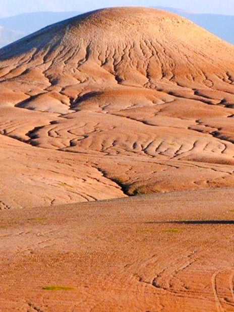 ATV driving across the Agafay Desert landscape near Marrakesh.