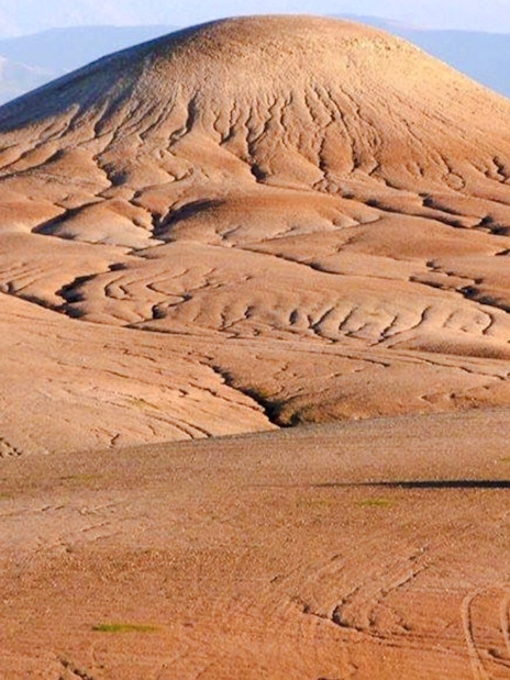 ATV driving across the Agafay Desert landscape near Marrakesh.