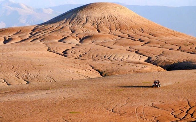 ATV driving across the Agafay Desert landscape near Marrakesh.