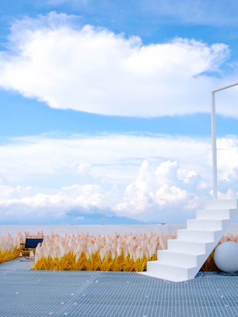 Staircase leading to a door frame against a cloudy sky at Hoverland, Wyndham Ion Majestic Hotel, Genting Highlands.