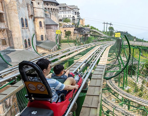French village architecture in Ba Na Hills Park, Da Nang, with cobblestone streets and European-style buildings.