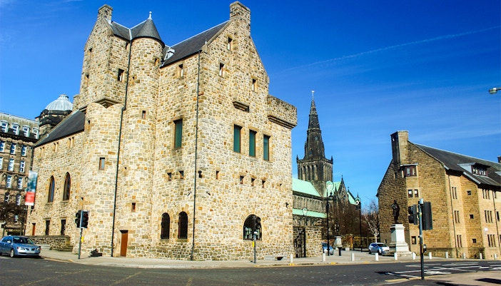 St. Mungo Museum and Glasgow Cathedral in the background on a sunny day.