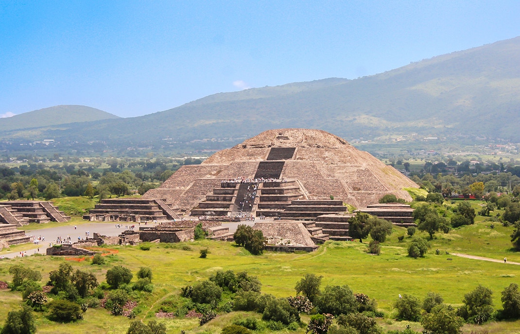 Pyramid of the Moon in Teotihuacan, Mexico with surrounding ancient ruins.