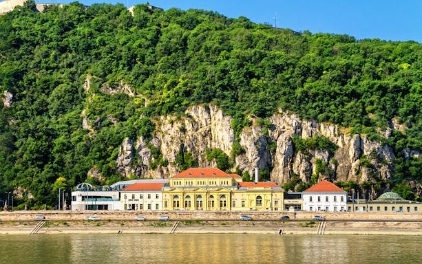 Rudas Thermal Spa exterior with hillside backdrop in Budapest.
