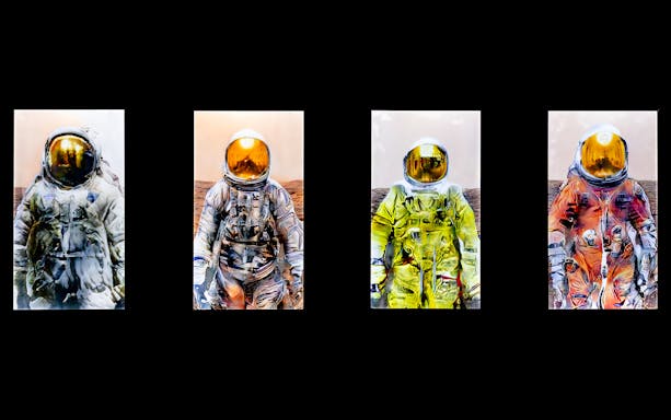 Astronaut suits artwork at ArtScience Museum, Singapore.