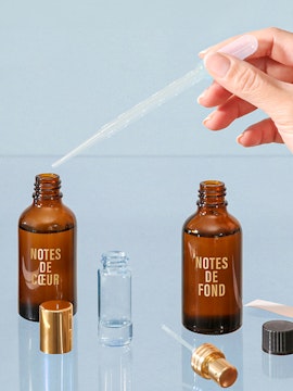 Perfume blending with pipette and Fargonard bottles.