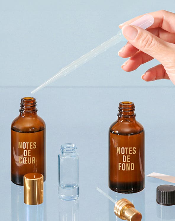 Perfume blending with pipette and Fargonard bottles.