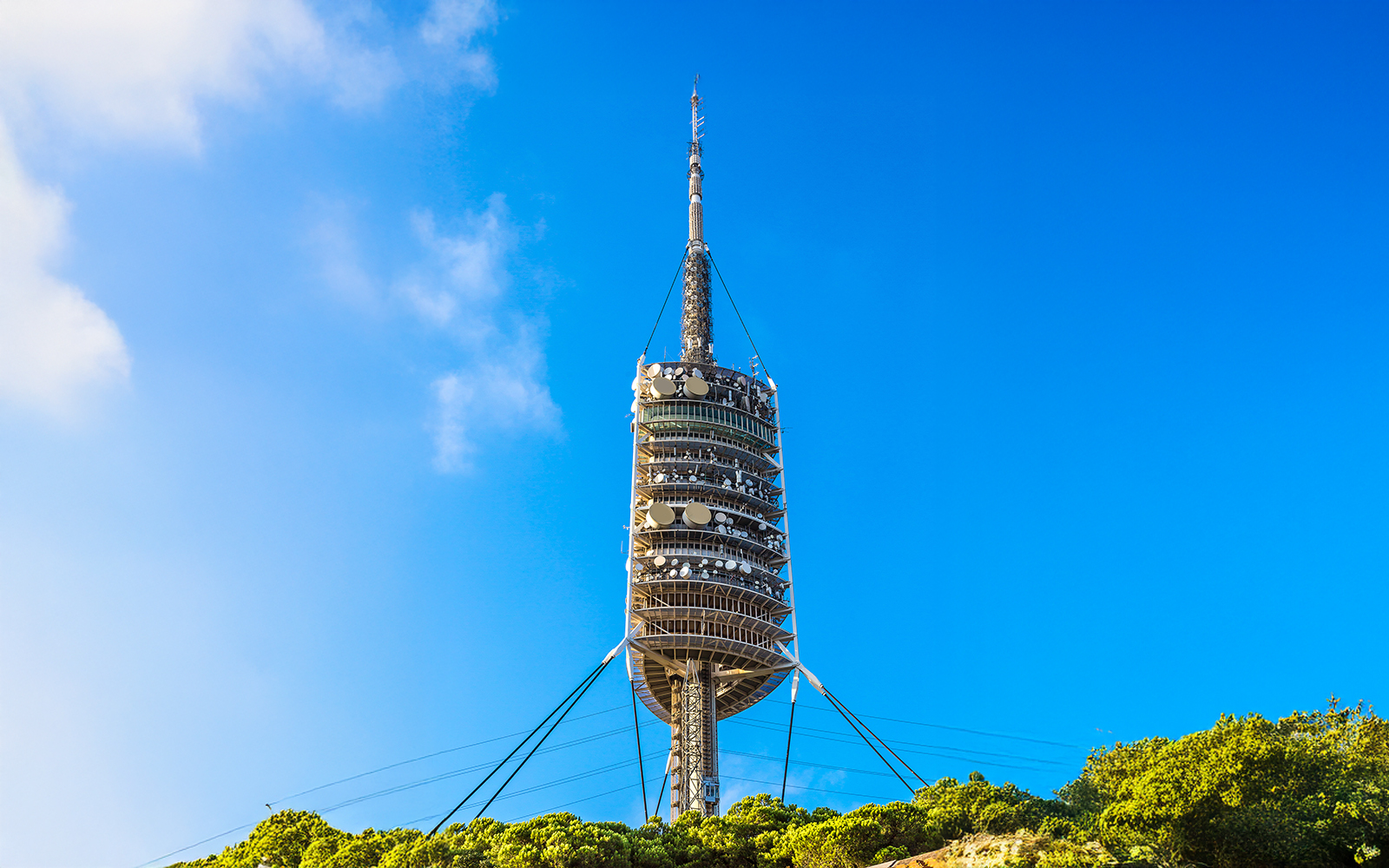 Torre de Collserola TV tower against blue sky in Barcelona.
