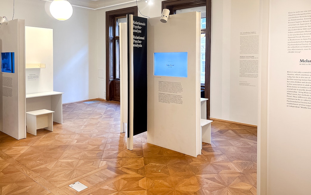 Sigmund Freud Museum exhibit room with informational panels and wooden flooring.