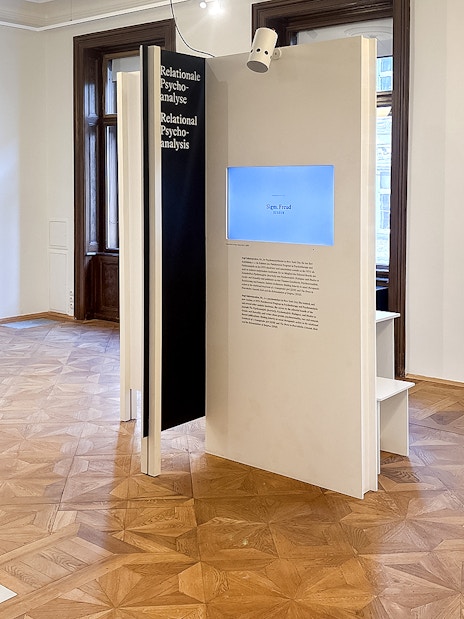 Sigmund Freud Museum exhibit room with informational panels and wooden flooring.