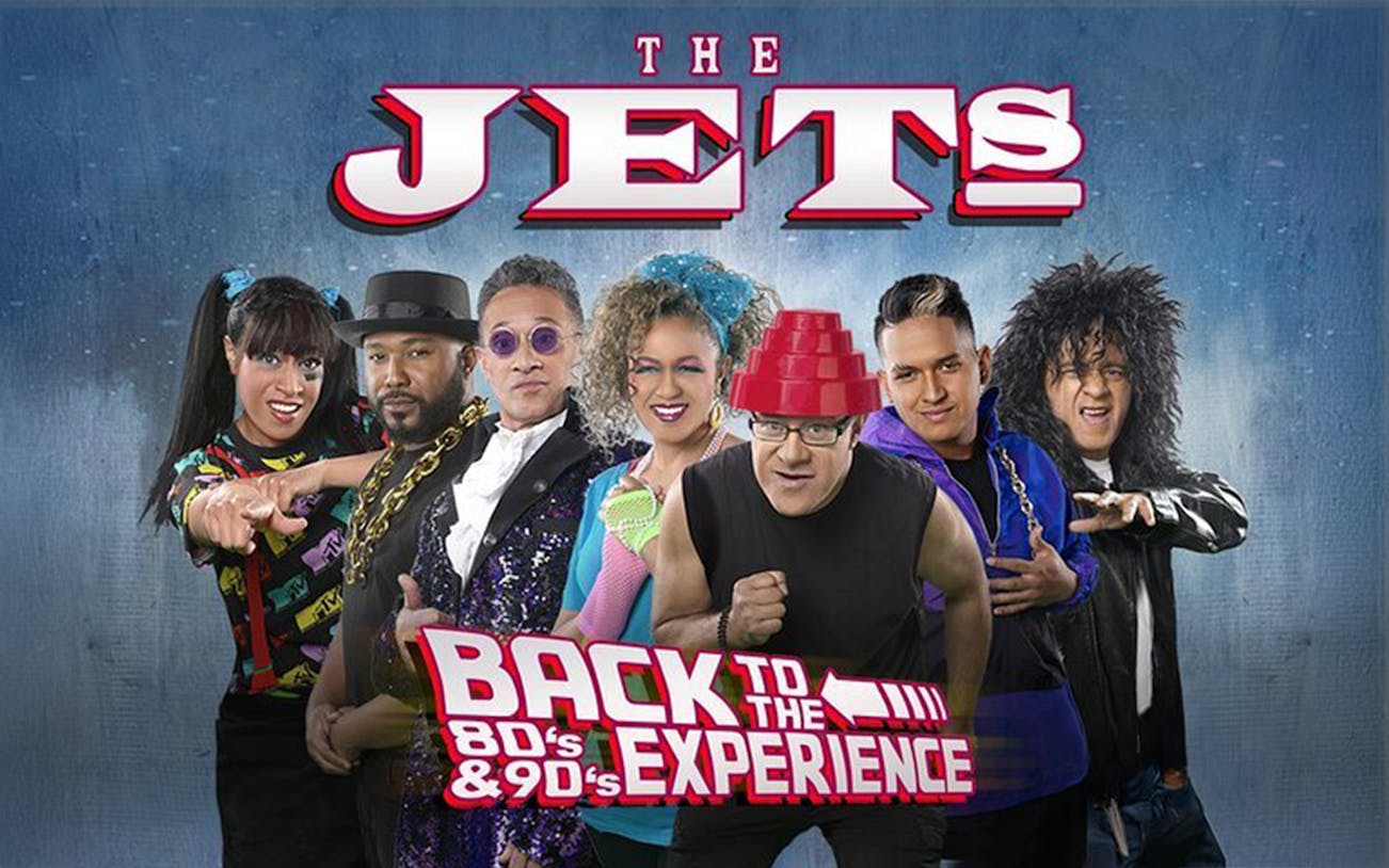 The Jets band members in 80's and 90's themed attire for Back to the 80's & 90's Experience.
