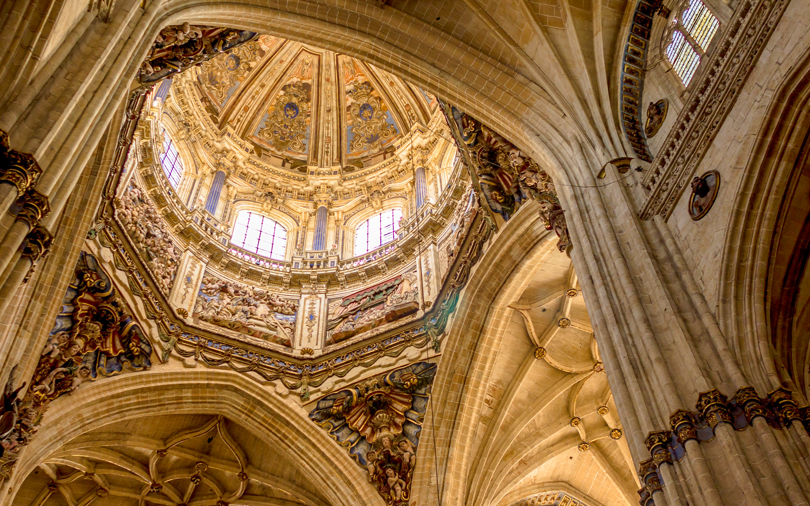 Dome interior of the New Cathedral in Salamanca, Spain, showcasing intricate architectural details.