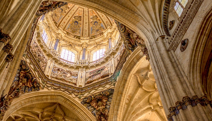 Dome interior of the New Cathedral in Salamanca, Spain, showcasing intricate architectural details.