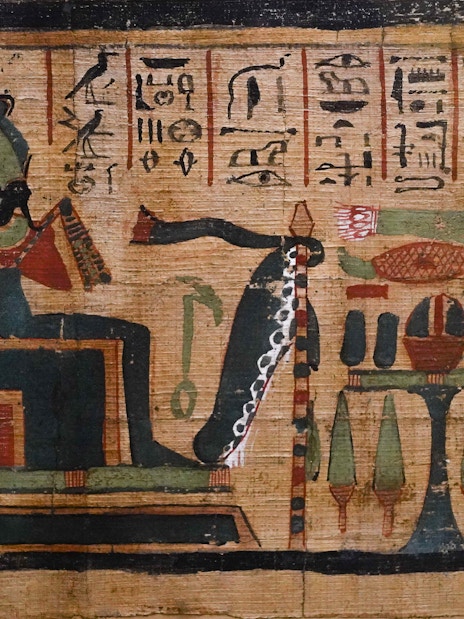 Ancient Egyptian papyrus painting with hieroglyphics and deities.