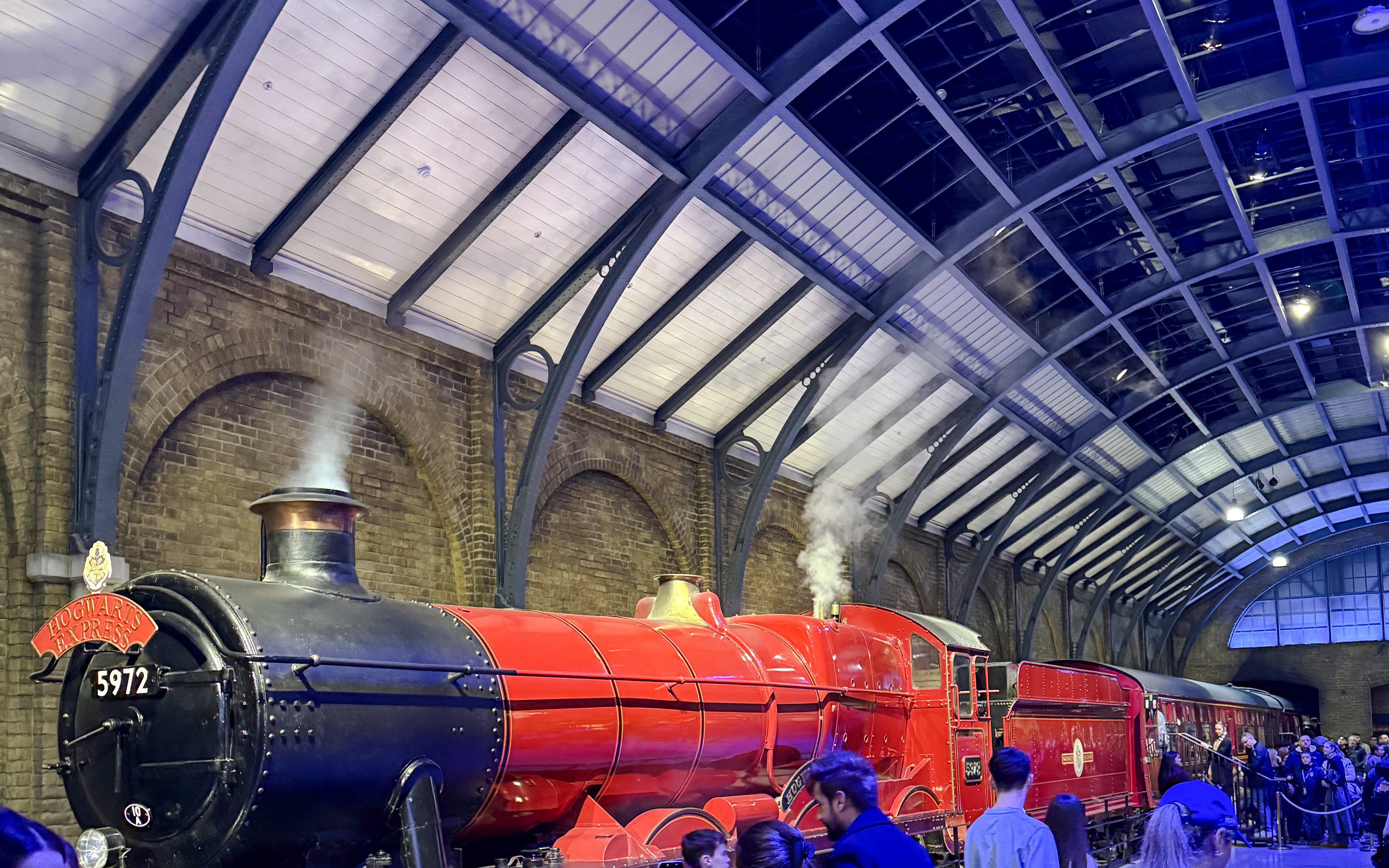 Hogwarts Express train at Platform 9 ¾, King's Cross Station, London.