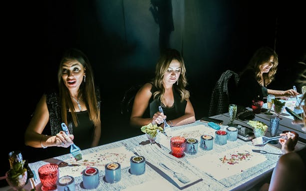Guests painting with food at Seven Paintings Immersive Dining Show, enjoying a 7-course menu.