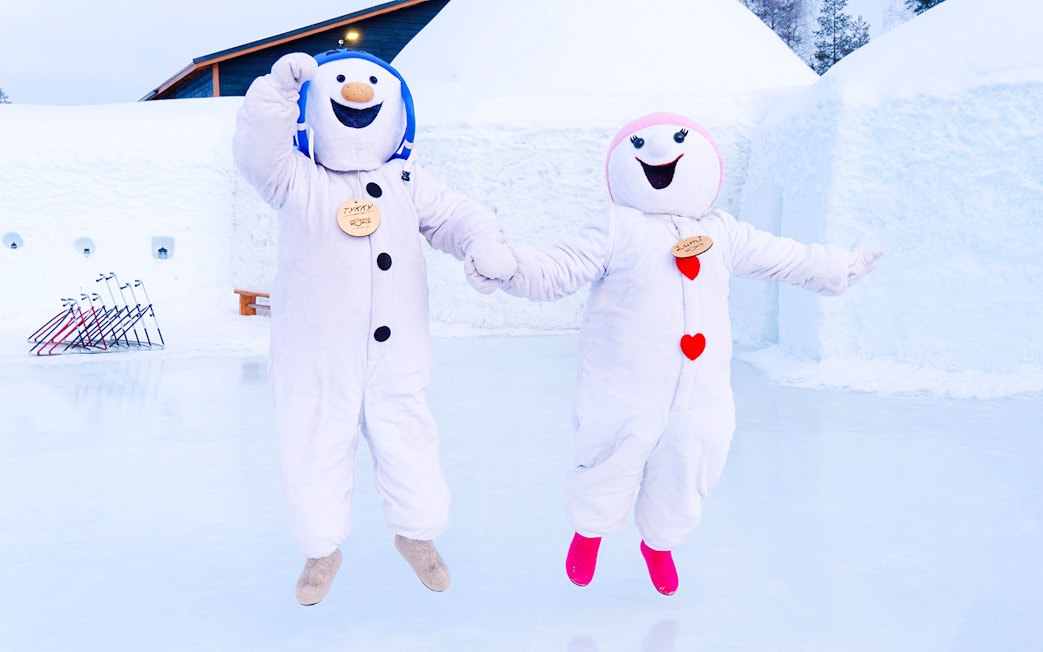 Snowmen characters jumping at Snowman World, Santa Claus Village.