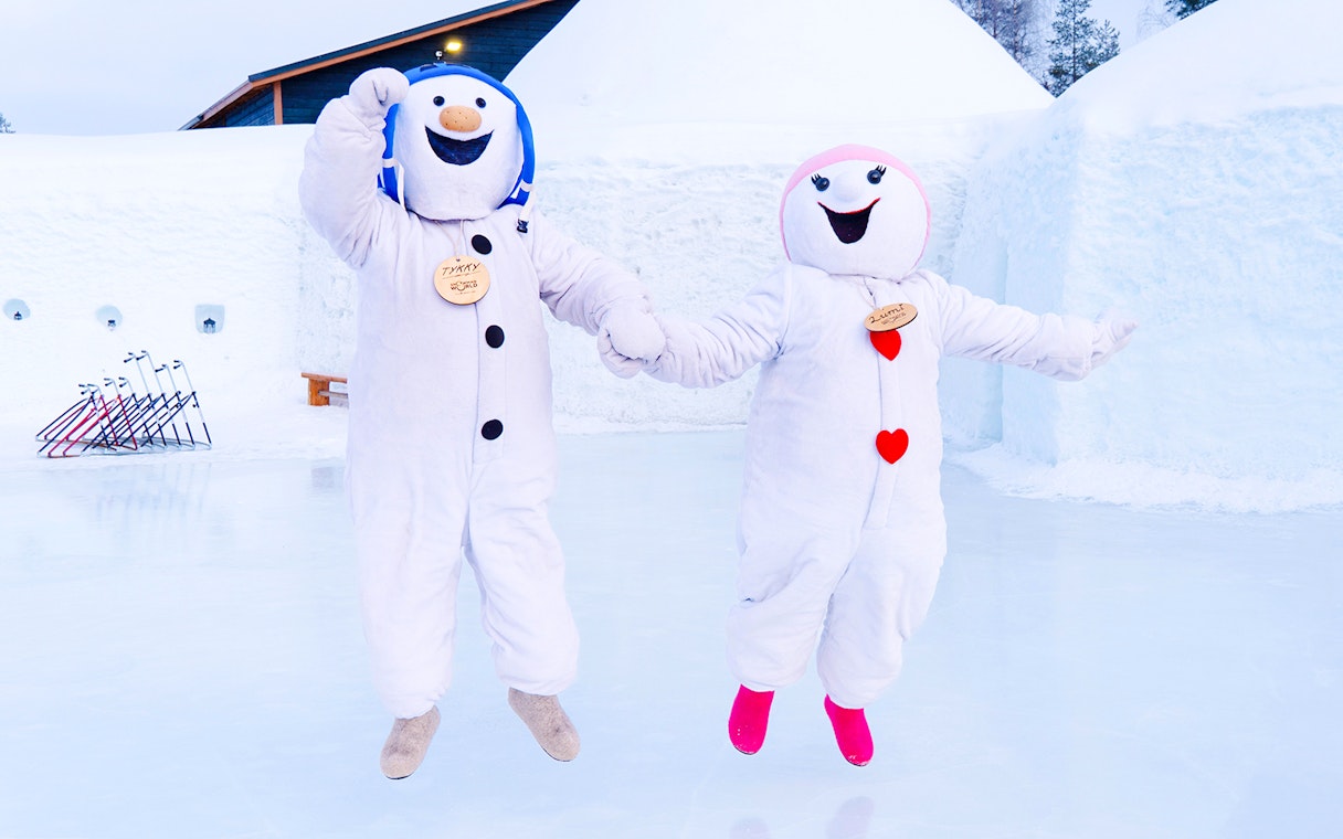 Snowmen characters jumping at Snowman World, Santa Claus Village.