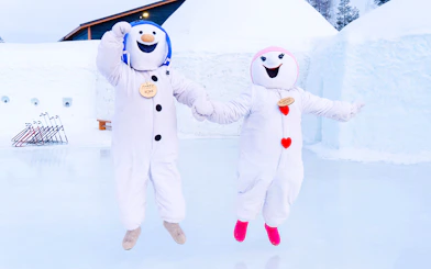 Snowmen characters jumping at Snowman World, Santa Claus Village.