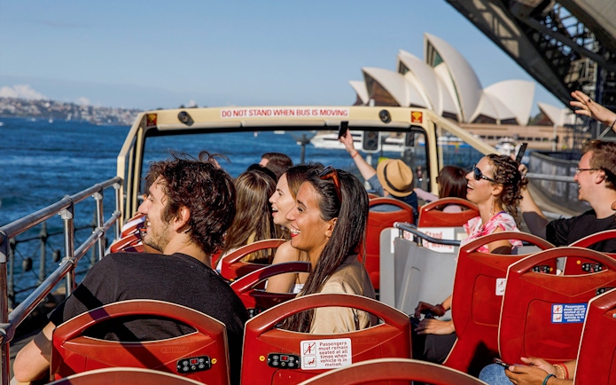 Passengers on Big Bus Sydney near Sydney Opera House.