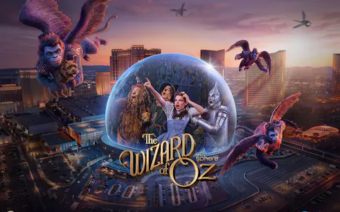Wizard of Oz characters in a dome with flying monkeys over a cityscape backdrop