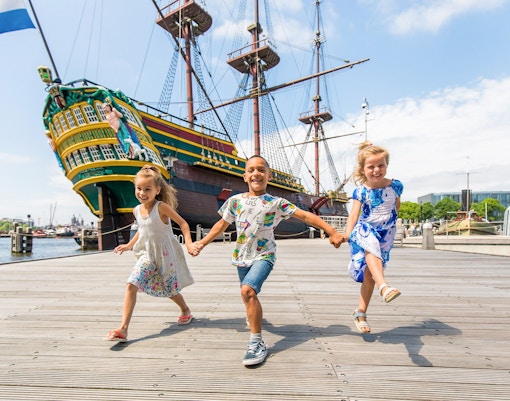 Children exploring outside the National Maritime Museum in Greenwich, London.
