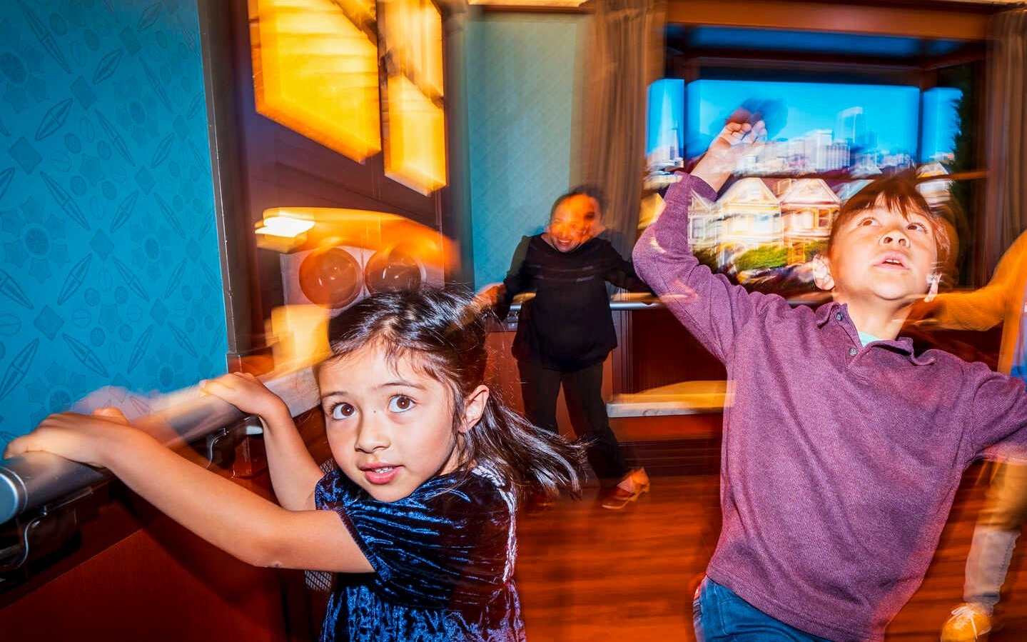 Children experiencing Earthquake Shake House at California Academy of Sciences.